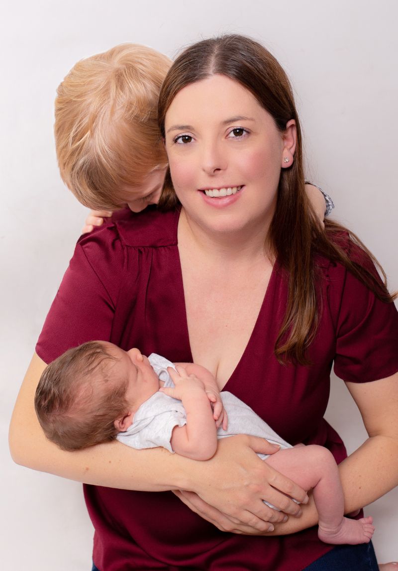 nicola_walsh_digital_marketing_coach_with_her_two_boys Photo of Nicola Walsh of New Wisdom Design and Digital holding baby son with older son looking over shoulder
